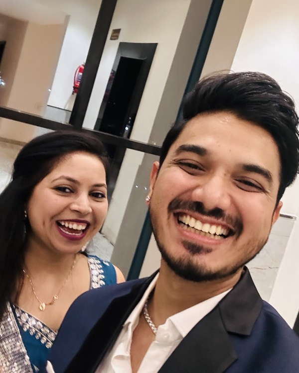 A close selfie of the two of us, dressed up and smiling